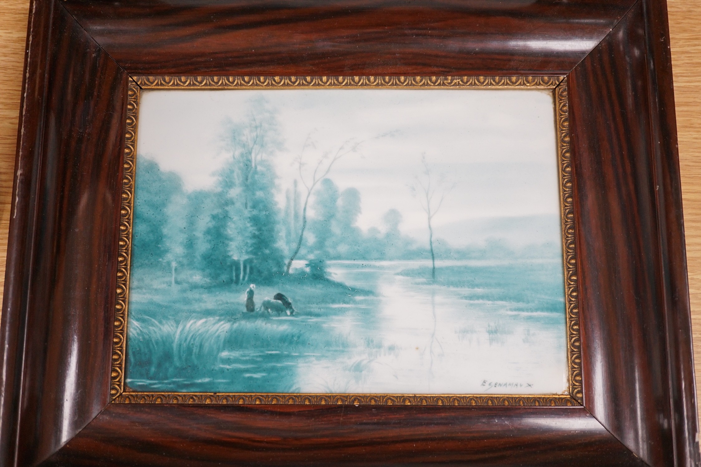 A French porcelain landscape plaque, indistinctly signed ‘E GENAMAN’